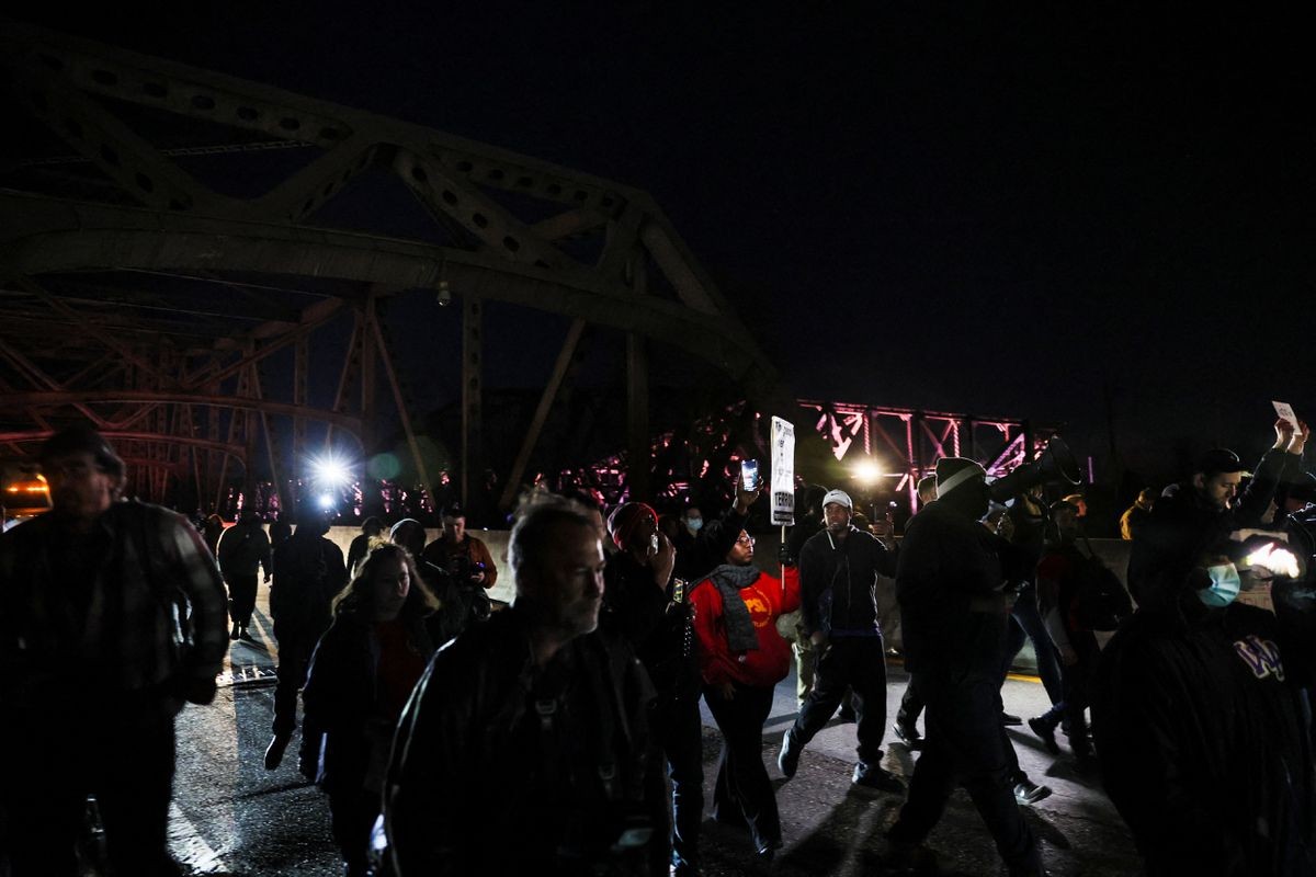 People gather on the day of the release of a video showing police officers beating Tyre Nichols, the young Black man who was killed during a traffic stop by Memphis police officers, in downtown Memphis, Tennessee, U.S., January 27, 2023. REUTERS/Leah Millis People gather on the day of the release of a video showing police officers beating Tyre Nichols, the young Black man who was killed during a traffic stop by Memphis police officers, in downtown Memphis, Tennessee, U.S., January 27, 2023. REUTERS/Leah Millis