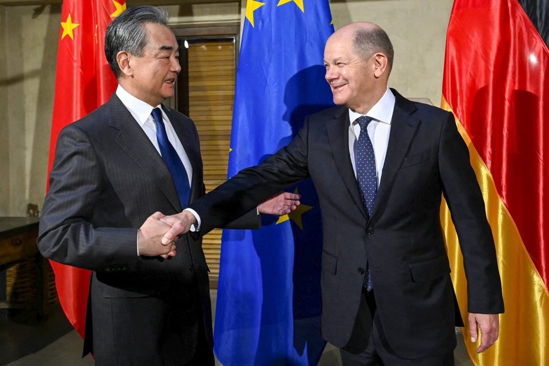 German Chancellor Olaf Scholz (right) greets top Chinese diplomat Wang Yi at the Munich Security Conference in Munich, Germany, on Friday. Photo: AFP