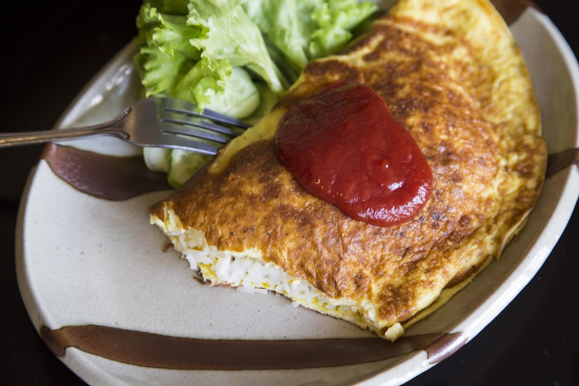 “Omurice”, hay cơm cuộn trứng chiên đã bất ngờ trở thành tâm điểm thú vị trong quan hệ Nhật Bản-Hàn Quốc. (Nguồn: Getty Images) “Omurice”, hay cơm cuộn trứng chiên đã bất ngờ trở thành tâm điểm thú vị trong quan hệ Nhật Bản-Hàn Quốc. (Nguồn: Getty Images)