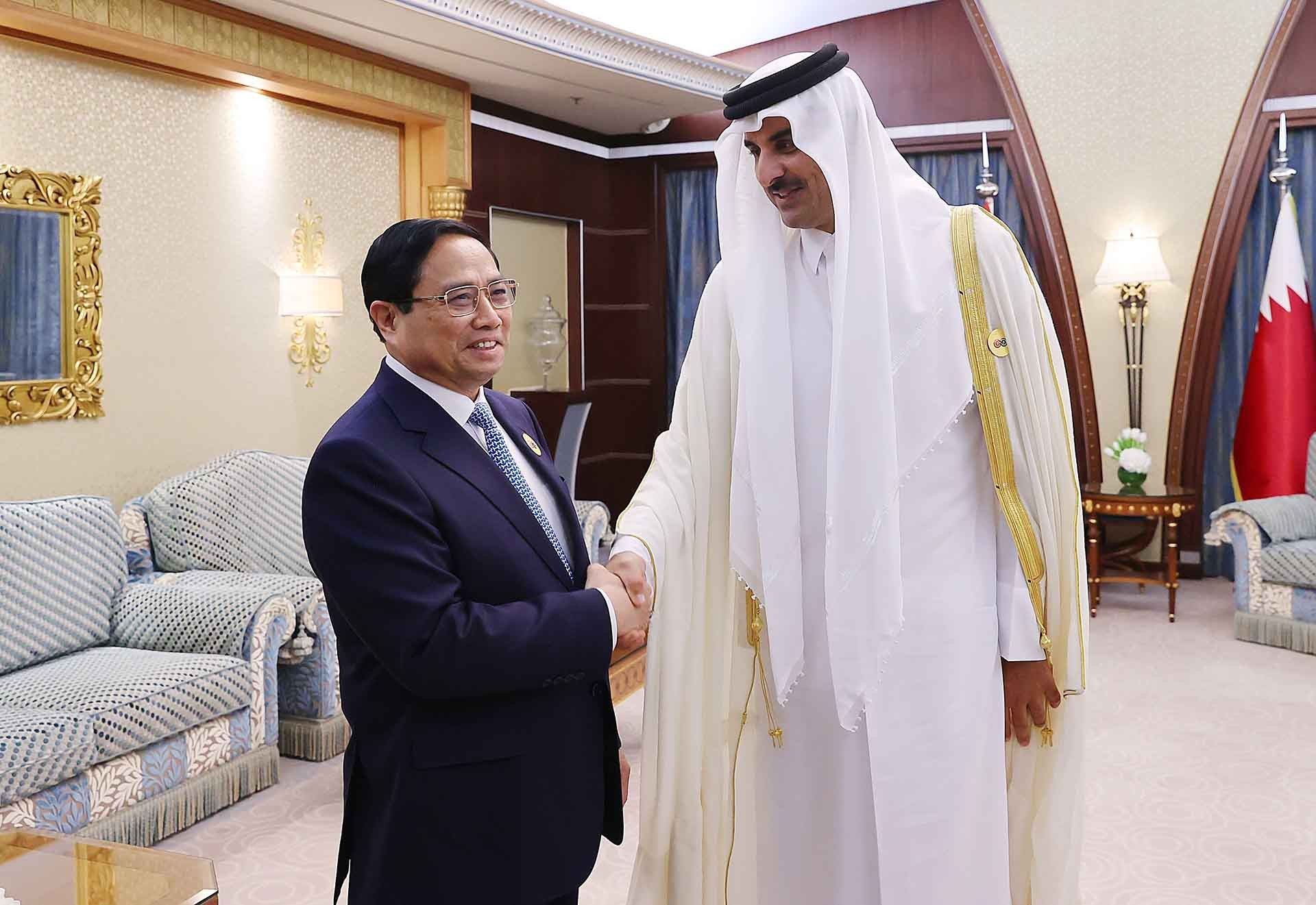Thủ tướng Phạm Minh Chính gặp Quốc vương Qatar Tamim bin Hamad Al Thani. (Nguồn: TTXVN) Thủ tướng Phạm Minh Chính gặp Quốc vương Qatar Tamim bin Hamad Al Thani. (Nguồn: TTXVN)