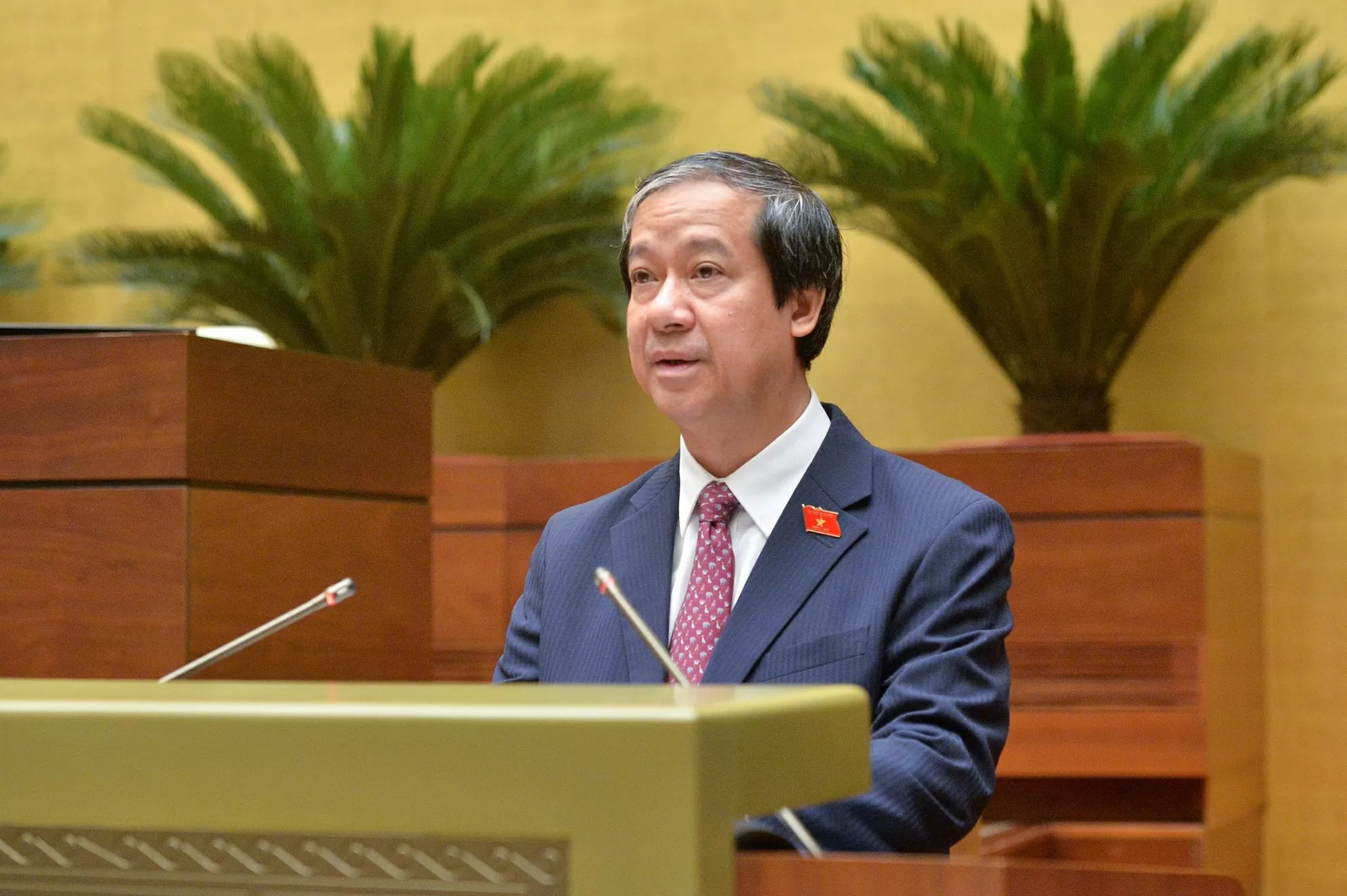 Bộ trưởng Bộ Giáo dục và Đào tạo Nguyễn Kim Sơn trình bày Tờ trình. (Nguồn: Quốc hội) Bộ trưởng Bộ Giáo dục và Đào tạo Nguyễn Kim Sơn trình bày Tờ trình. (Nguồn: Quốc hội)