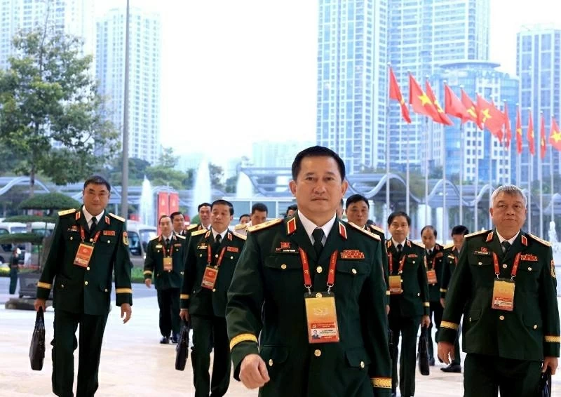 Các đại biểu Đoàn Đảng bộ Quân đội đến dự phiên thảo luận tại hội trường về các văn kiện Đại hội, sáng 21/1. Ảnh: TTXVN Các đại biểu Đoàn Đảng bộ Quân đội đến dự phiên thảo luận tại hội trường về các văn kiện Đại hội, sáng 21/1. Ảnh: TTXVN