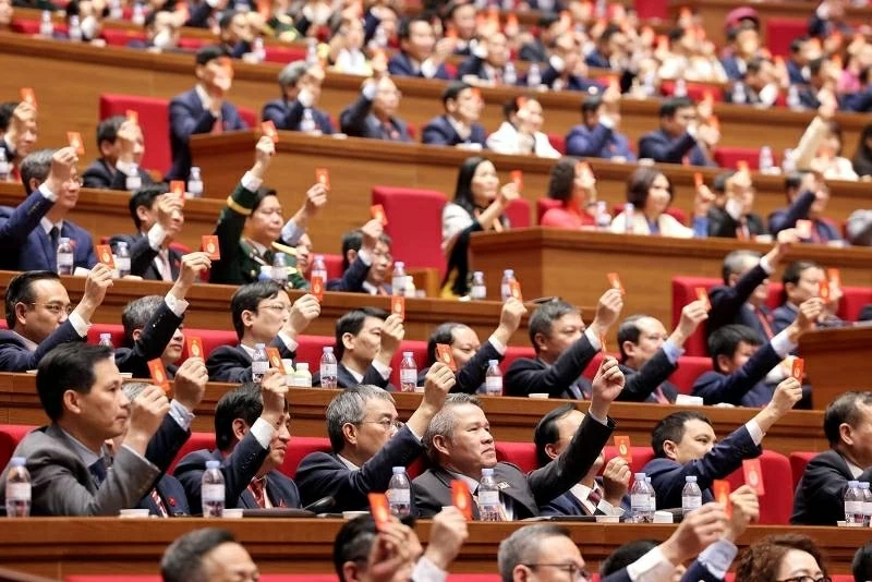 Đại hội biểu quyết thông qua dự thảo điều chỉnh chương trình Đại hội. Ảnh: TTXVN