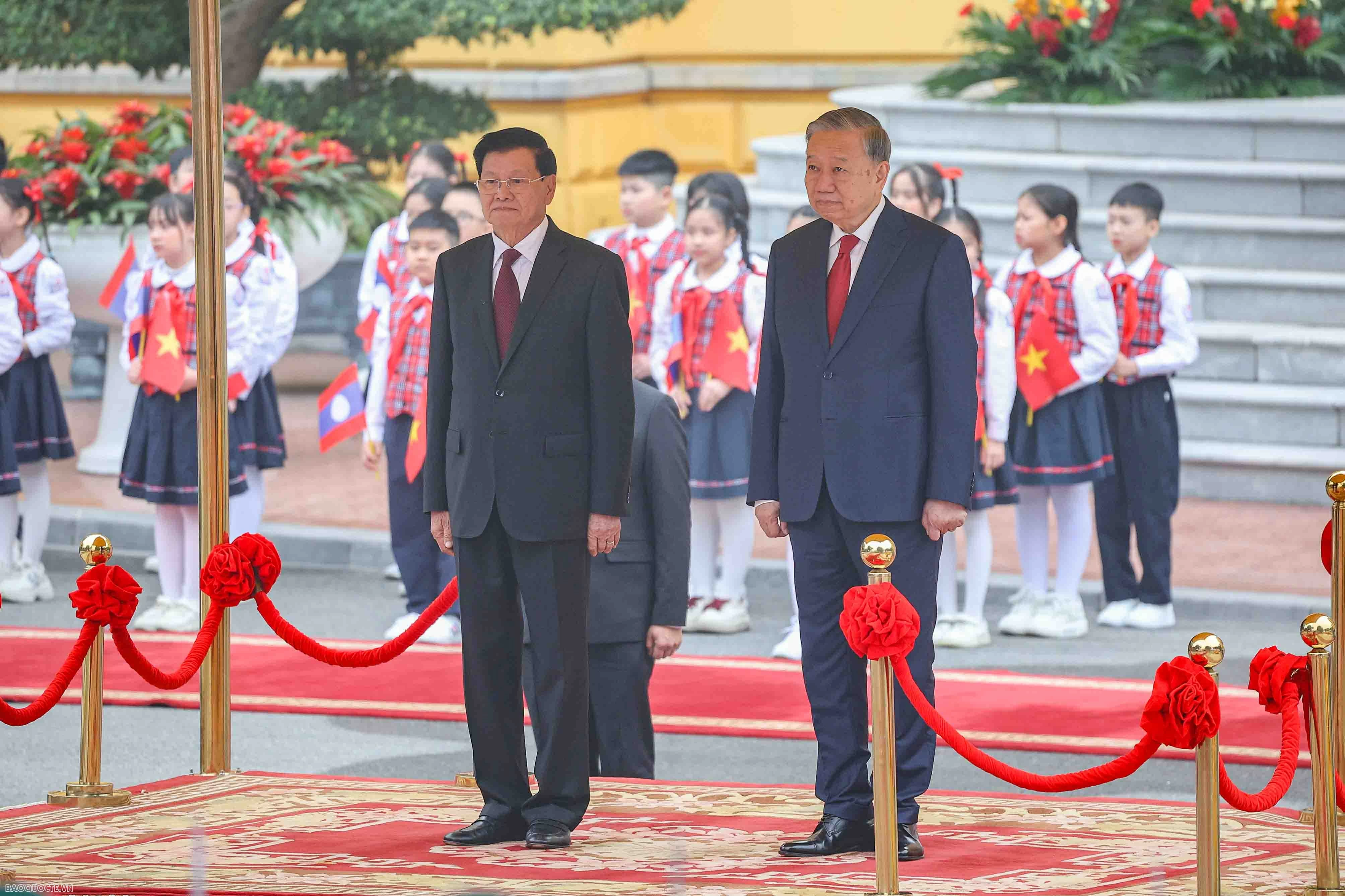 Lễ đón chính thức Tổng Bí thư, Chủ tịch nước Lào và Phu nhân