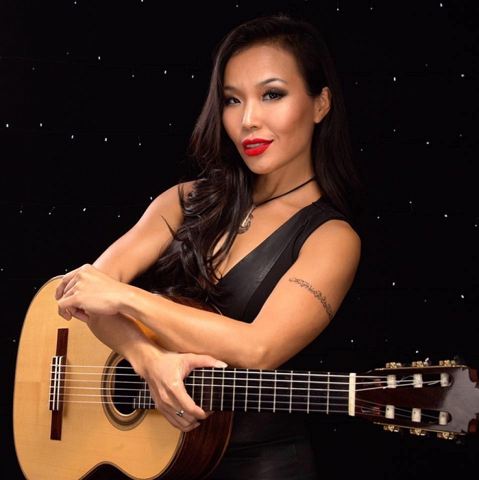 nghe si guitar le thu khong con thay nho be voi the gioi