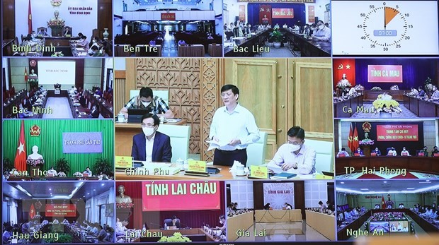 Hội nghị trực tuyến với các điểm cầu tại các địa phương trong cả nước. (Nguồn; TTXVN)