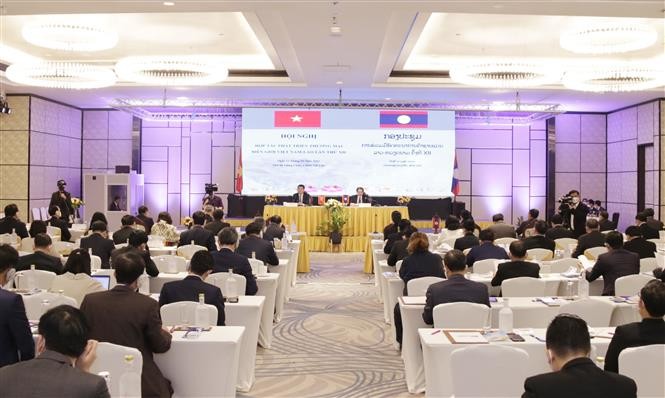 Quang cảnh Hội nghị Hợp tác phát triển thương mại biên giới Việt Nam-Lào lần thứ XI. (Nguồn: TTXVN)I