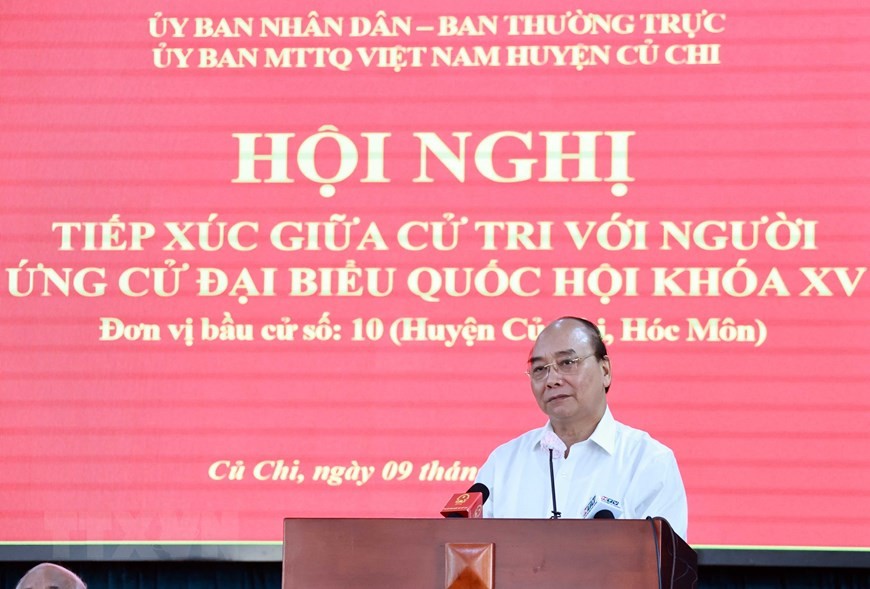 Chủ tịch nước Nguyễn Xuân Phúc trình bày chương trình hành động tại buổi tiếp xúc cử tri huyện Củ Chi ngày 9/5. (Ảnh: Thống Nhất/TTXVN)