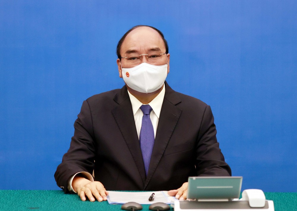 Chủ tịch nước Nguyễn Xuân Phúc đã có cuộc điện đàm với Tổng thống Cộng hòa Pháp Emmanuel Macron. (Nguồn: TTXVN)