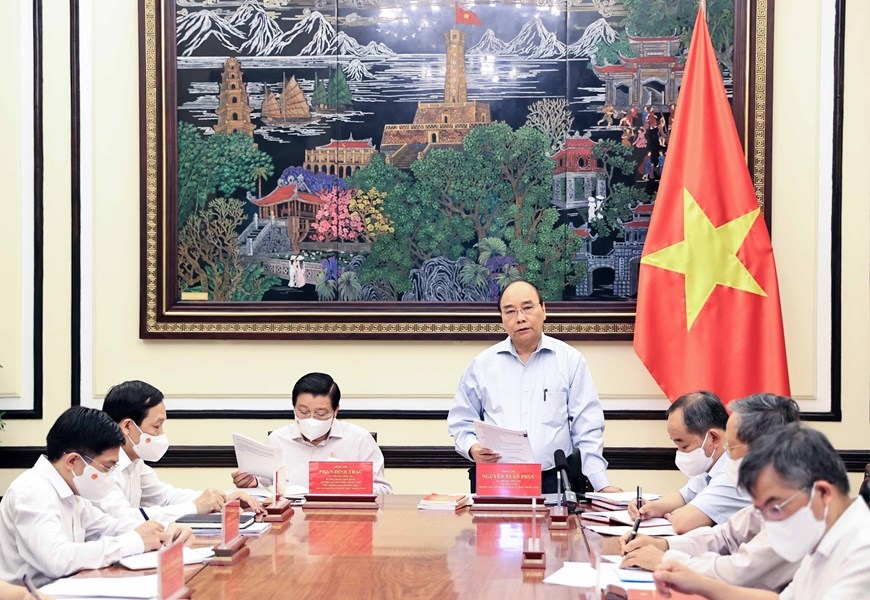 Chủ tịch nước Nguyễn Xuân Phúc, Trưởng ban Cải cách Tư pháp Trung ương phát biểu. (Nguồn: TTXVN)
