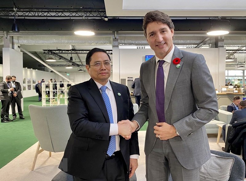Thủ tướng Phạm Minh Chính gặp Thủ tướng Canada Justin Trudeau. (Nguồn: TTXVN)