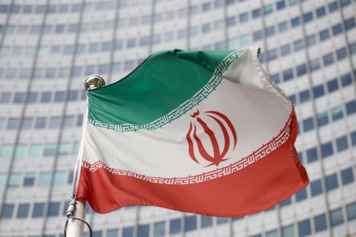 The Iranian flag waves in front of the International Atomic Energy Agency (IAEA) headquarters in Vienna, Austria, March 1, 2021. REUTERS/Lisi Niesner