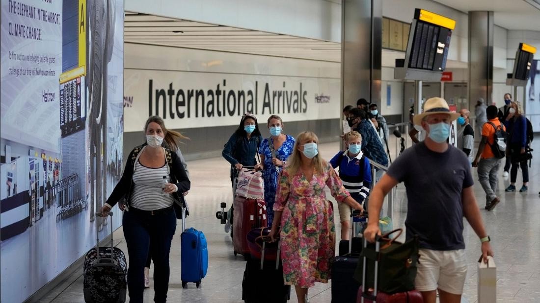 Passengers arriving into Heathrow Airport in London Passengers arriving into Heathrow Airport in London