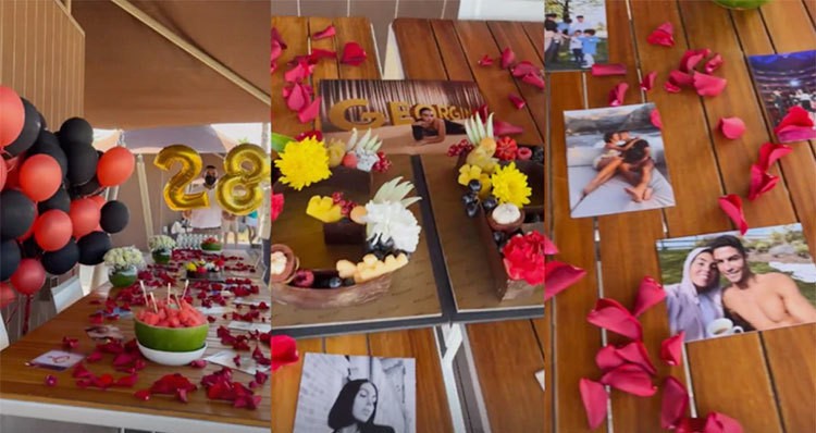 Tờ AS đăng ảnh không gian tiệc với bóng bay, ảnh của Georgina và CR7 trên bàn rắc cánh hoa hồng bên cạnh các món ăn.
