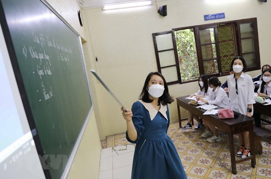 Dạy và học trực tiếp gắn với công tác phòng chống dịch Covid-19 cho học sinh và giáo viên. (Nguồn: TTXVN) Dạy và học trực tiếp gắn với công tác phòng chống dịch Covid-19 cho học sinh và giáo viên. (Nguồn: TTXVN)