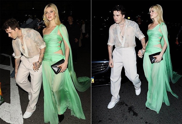 Vợ chồng Brooklyn Beckham tay trong tay tới dự tiệc hậu Met Gala tại New York. Đôi uyên ương mới cưới cùng diện trang phục xuyên thấu đồng điệu. Trong khi Brooklyn mặc áo sơ mi trắng mỏng lộ rõ loạt hình xăm, Nicola khoe thân hình gợi cảm trong bộ đầm cắt khoét ở eo, xuyên thấu ở chân.