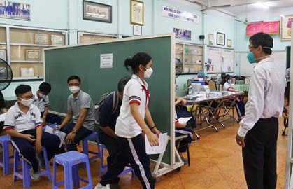 Trẻ em từ 5 đến dưới 12 tuổi làm thủ tục tiêm vaccine Covid-19 tại TP. Hồ Chí Minh. (Ảnh: PA)