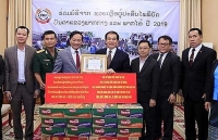 Cộng đồng người Việt giúp người dân Lào khắc phục hậu quả mưa lũ